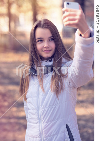 Beautiful girl takes a picture of the self 21892845