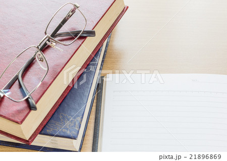 Eyeglasses and Notebook open blank page 21896869