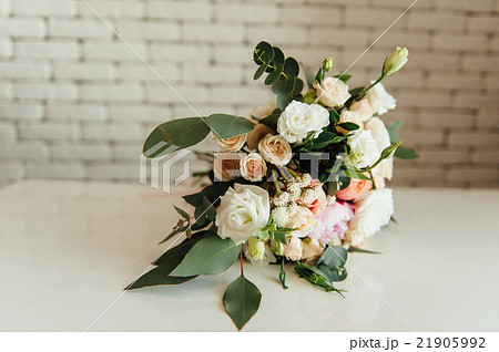 beautiful modern wedding bouquet on table 21905992