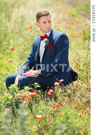 Serious Groom in the nature 21918145