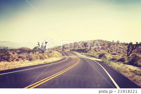 Vintage toned desert road seen through windshield. 21918221