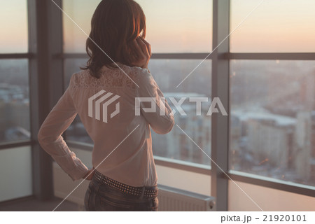 Rear view portrait of young worker speaking using 21920101