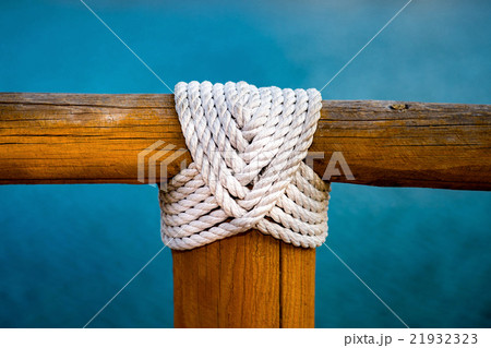 white rope wood cross on blue 21932323