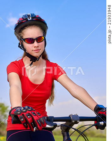 Bikes cycling girl wearing helmet. 21933948