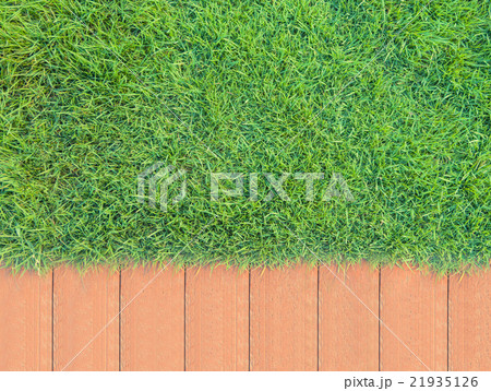 Green Grass Background and Red brick Green Grass Background and Red brick 21935126