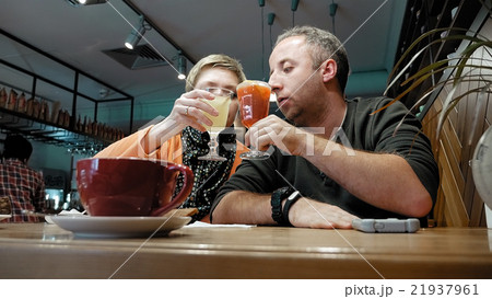 Couple man and woman eats talks in cafe restaurant Couple man and woman eats talks in cafe restaurant 21937961