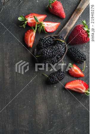 Berries on dark wooden background. Fresh Berries on dark wooden background. Fresh 21940276