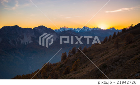 Last sunlight on majestic mountain peak 21942726