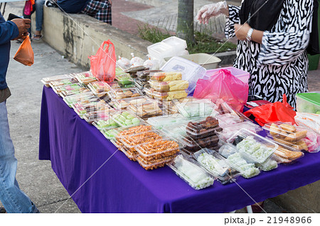 Vendor selling Malay sweet cakes food at stall Vendor selling Malay sweet cakes food at stall 21948966