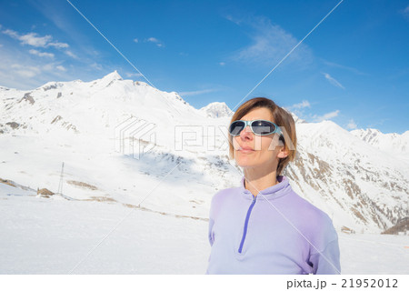 Female alpinist watching the sun 21952012
