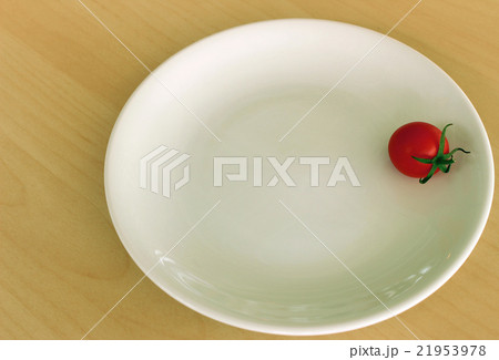 Cherry tomato on white dish 21953978