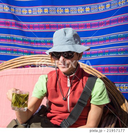 Lady having coca leaves tea, known as "Mate de Coca" 21957177
