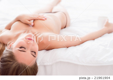Amateur Nude Girls Porn - Seductive girl lying in bed half naked - Stock Photo [21961904] - PIXTA