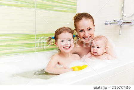 bathing in bath with foam mother together children baby bathing in bath with foam mother together children baby 21976439