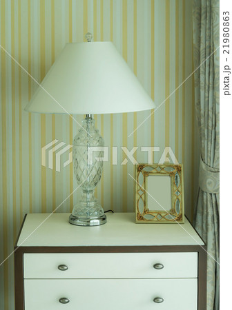 Bedside table with lamp, and picture frame 21980863