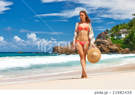 Woman with sarong on beach at Seychelles 21982439