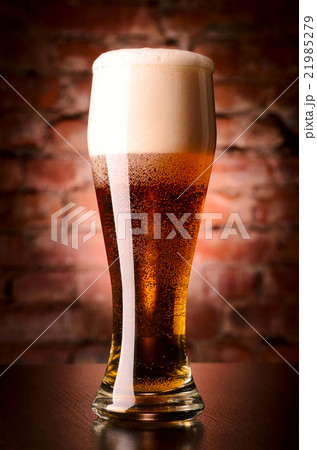 glass of lager on table glass of lager on table 21985279