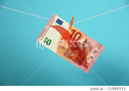 Euro decline illustrated over blue Euro decline illustrated over blue 21988333