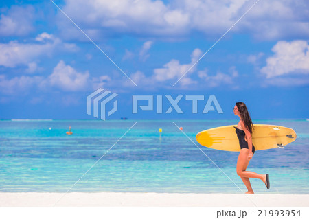 Beautiful surfer woman surfing during summer Beautiful surfer woman surfing during summer 21993954