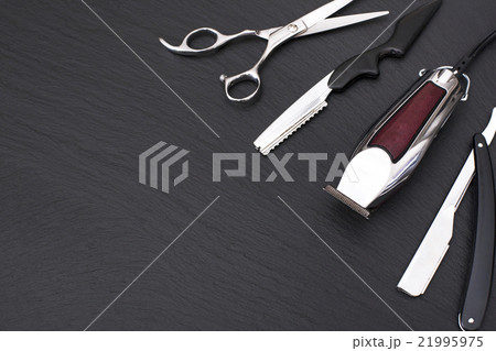 Barber shop tools on Black with place for text. 21995975