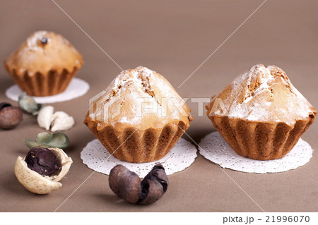 Muffin cakes on a Beige - coffee background. 21996070