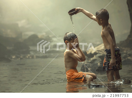 Two boys on the creek 21997753