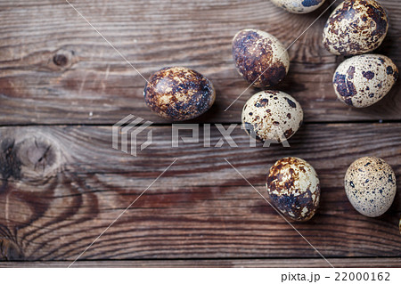 Group of quail eggs on thewooden background 22000162