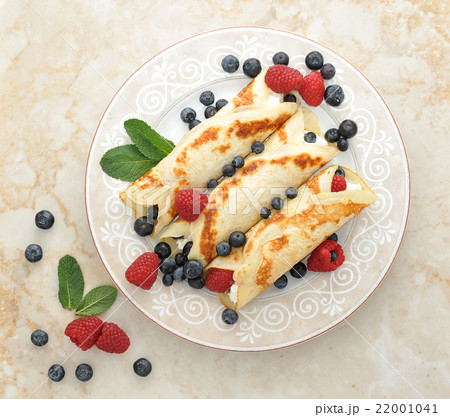 pancakes with cottage cheese and berries. top view 22001041
