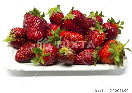 Fresh strawberries on a plate on white background Fresh strawberries on a plate on white background 22007840