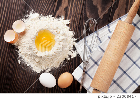 Kitchen table with utensils and ingredients 22008417