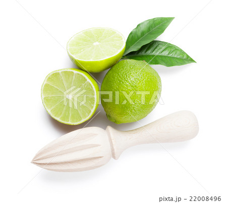 Fresh ripe limes and juicer Fresh ripe limes and juicer 22008496