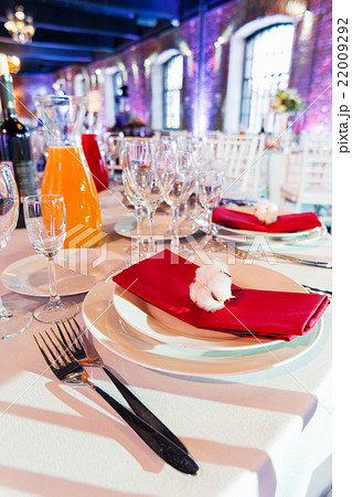 Table set for banquet with cutlery.  22009292