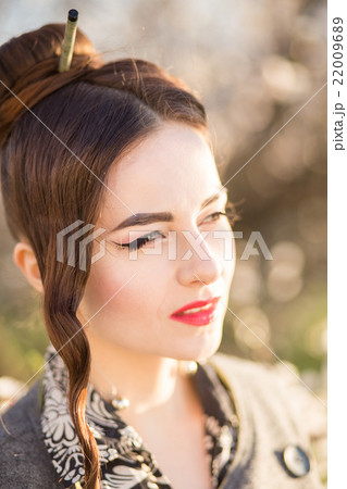 Beautiful young woman with japanese style make-up 22009689