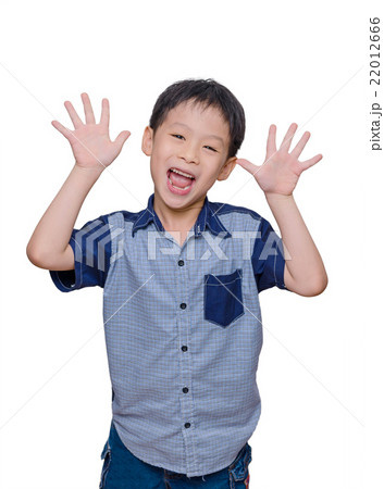 Young Asian boy smiling over white background Young Asian boy smiling over white background 22012666
