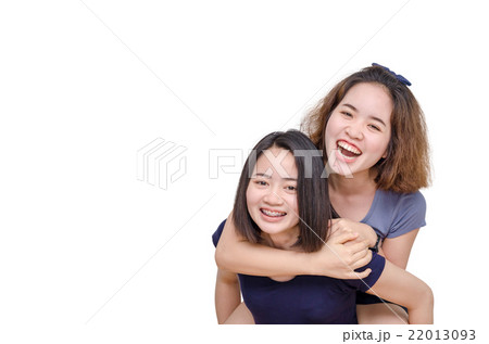 Young Asian girls smiling over white background Young Asian girls smiling over white background 22013093