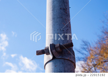Dirty metal pole with rusted fastener. Dirty metal pole with rusted fastener. 22015192