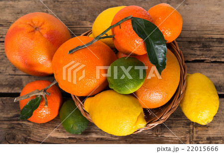 Citrus fruits on wooden background 22015666