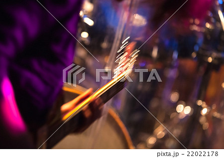 Blurred rock music background, guitar player Blurred rock music background, guitar player 22022178
