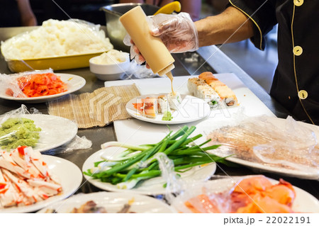 Preparing of sushi rolls with salmon 22022191
