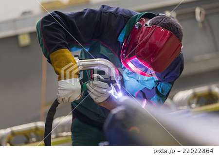 Industrial worker welding in metal factory. Industrial worker welding in metal factory. 22022864
