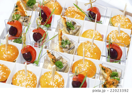 mini canapes in plastic cups decorated with edible 22023392