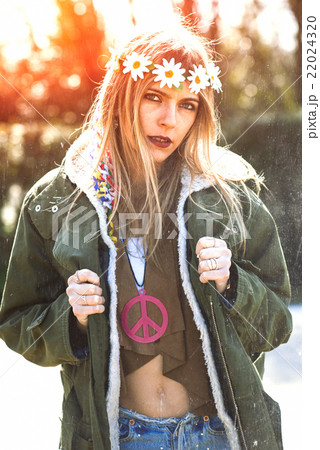 Girl hippie revolutionary 1970 style. Picture ruined simulation Girl hippie revolutionary 1970 style. Picture ruined simulation 22024320