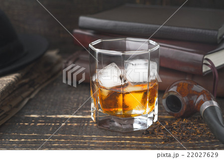Whiskey with pipe , hat and newspaper 22027629