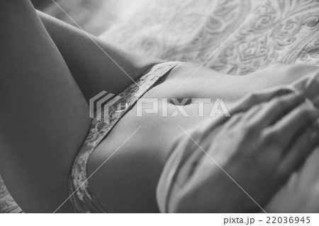 Sexy young woman in lingerie posing on the bed Sexy young woman in lingerie posing on the bed 22036945