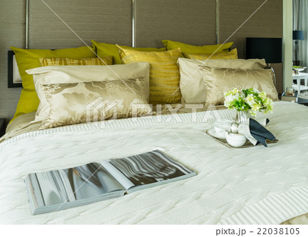 Decorative set with book,tea set on bed Decorative set with book,tea set on bed 22038105
