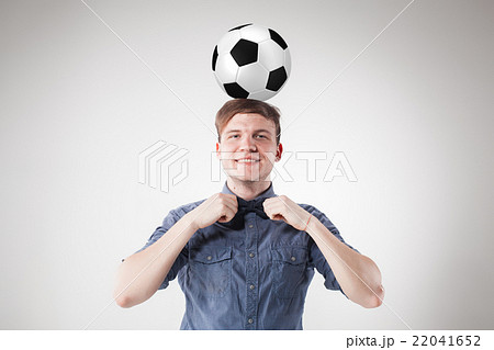 The guy with ball on gray background The guy with ball on gray background 22041652