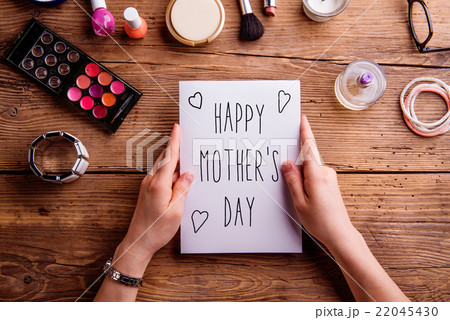 Mothers day composition. Greeting card and make up Mothers day composition. Greeting card and make up 22045430