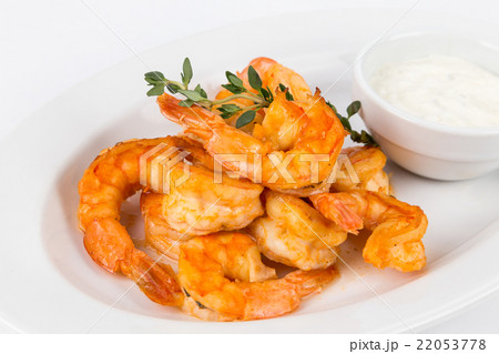portion hot shrimps on white plate 22053778