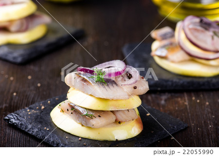 Appetizer canape with herring, apples 22055990