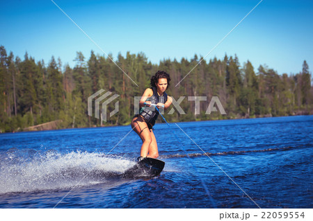 Woman study wakeboarding on a lake 22059554